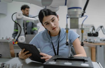 Hispanic engineer woman working on AI technology in robotics electronics engineering laboratory