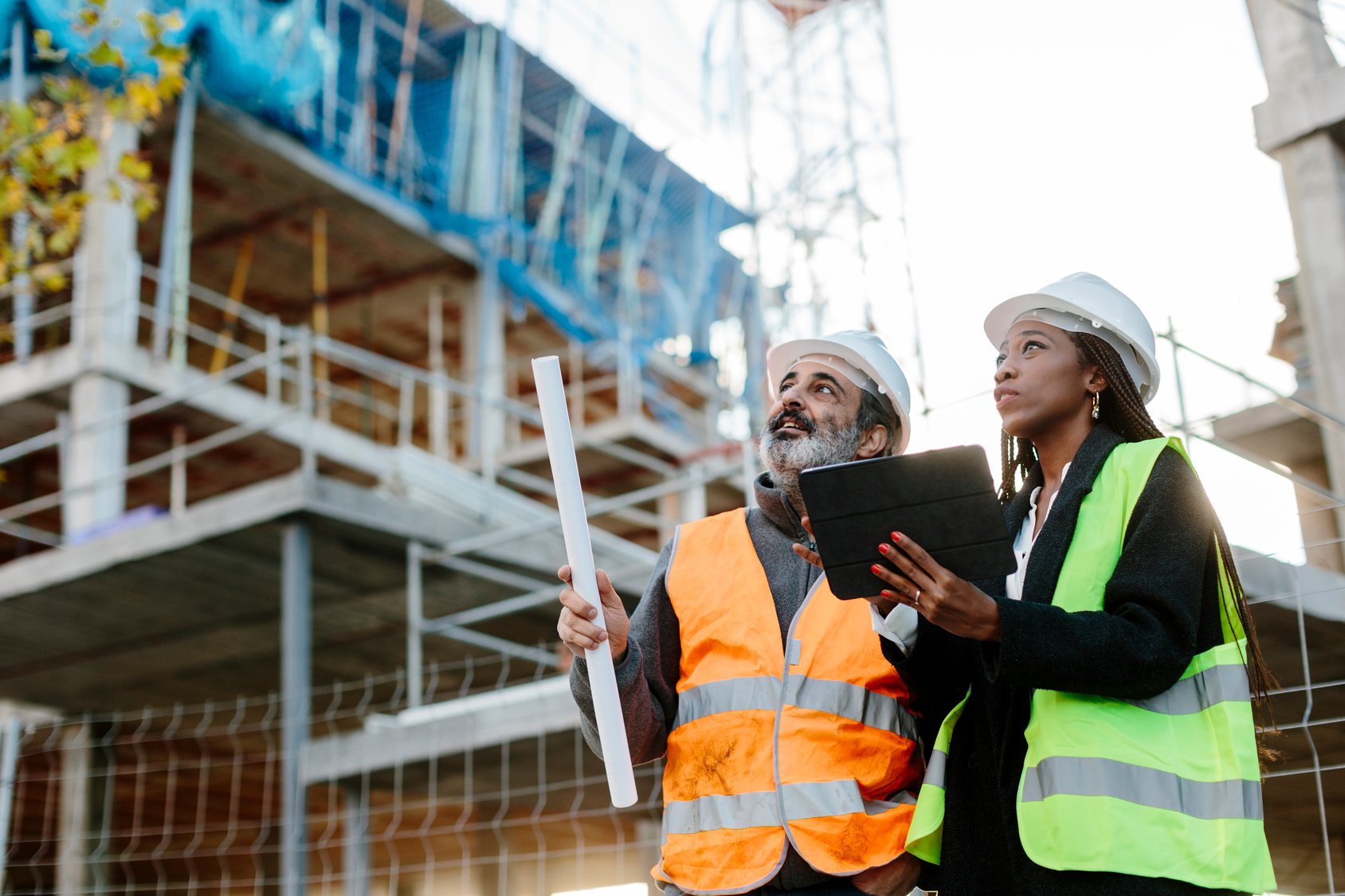 man-and-woman-surveying-construction-site