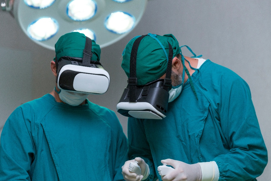 Doctor surgeon wearing virtual reality glasses. The surgeon is doing surgery by inserting a camera and using a VR controller.